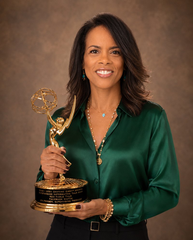 Jen Friesen holding her Daytime Emmy Award for Red Table Talk